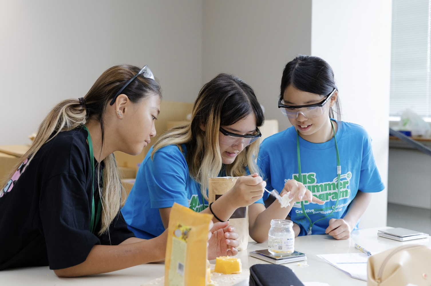 NIS students doing a science experiment at the summer program