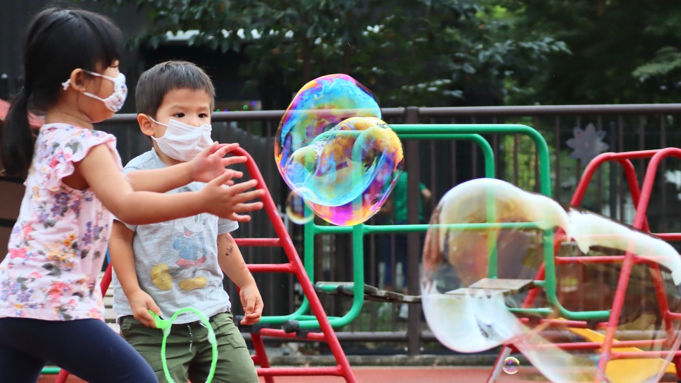 Children playing with soap bubbles