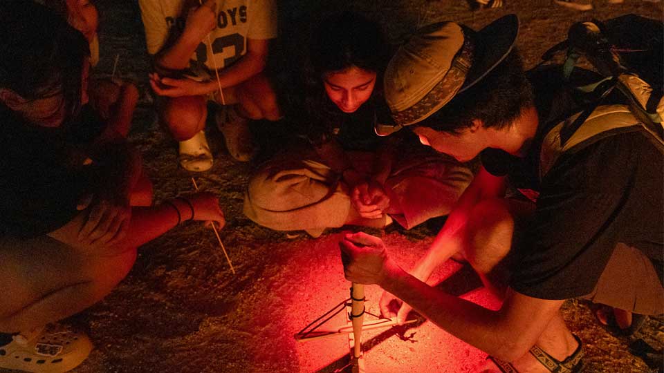 making a campfire on nis student retreats